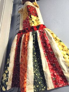 a dress hanging from a hook on a wall