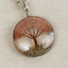 What a truly special piece the Sephira Life Tree Pendant Necklace is! A beautiful, blooming tree of life design is embedded into clear resin, which hangs as a pendant from a silver-toned chain. Makes a perfect gift for a beloved grandparent or family member, symbolizing ancestral roots. Lovingly handcrafted by artisans with Intercrafts Peru, a cooperative with more than 700 makers who come together to strengthen communities by providing access to health care, loans, advances, and training while Spiritual Silver Necklace With Natural Inclusions, Nature-inspired Rose Gold Jewelry Gift, White Tree Of Life Jewelry Gift, Tree Of Life Pendant Necklace As Gift, Unique Tree Of Life Jewelry Gift, Nature-inspired Hypoallergenic Jewelry For Gifts, Spiritual Resin Jewelry As Gift, Spiritual Resin Jewelry Gift, Spiritual Resin Jewelry For Gifts