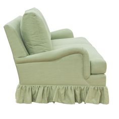 a green chair with ruffles on it