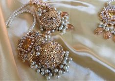 A must have for the upcoming wedding season! This bridal set is a unique blend of royal and modern with its pastel hues and gold plating. The set is gorgeous with pearls and is a full bridal piece but can be worn separately for a lighter and simple look. Set includes: mala , earrings, maang tikka , passa, choker In stock and ready to ship‰Û? Bollywood Style Gold Wedding Sets, Gold Bollywood Sets For Wedding, Elegant Gold Sets For Reception, Gold Kundan Bridal Earrings For Wedding, Gold Bollywood Bridal Earrings For Wedding, Gold Chandbali Bridal Accessories Hand Set, Gold Chandbali Hand Set Bridal Accessories, Gold Hand-set Bridal Earrings For Wedding, Gold Hand Set Bridal Earrings For Wedding