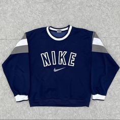 Amazing Condition Vintage Piece Bought For Myself But Was Too Small This Fits Like A Medium Imo Tag Marked Large Blue Embroidered Tops For Streetwear, Sporty Blue Embroidered Sweatshirt, Vintage Nike Clothes, Nike Crewnecks, Blue Sweatshirt Outfit, Dope Sweaters, Vintage Nike Sweater, Inspo Fits, Vintage Nike Sweatshirt