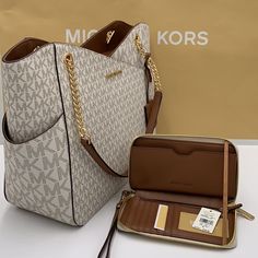 Michael Kors Large X Chain Shoulder Tote & Lg Flat Multifunctional Phone Case-Wristlet-Wallet Jet Set Large Logo Shoulder Bag Shoulder Bag Vanilla Signature Logo-Print Canvas 89.4% Coated Canvas/9.6% Polyester/1% Polyurethane Gold-Tone Hardware 15.6”W X 11”H X 5.5”D Handle Drop: 10" Exterior Details: Front Slip Pocket Interior Details: Back Zip Pocket, 2 Back Slip Pockets Lining: 100% Polyester Zip Fastening Imported & Lg Flat Multifunctional Phone Case Material: Leather/Pvc Removable Leather Wr Michael Kors Tote Bag, Michael Kors Tote Bags, Exterior Details, Michael Kors Shoulder Bag, Travel Tote Bag, Michael Kors Purse, Fancy Bags, Monogram Bag, Black Leather Handbags