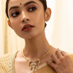 Description In this statement staple, a string of semi-precious Kundan buds come together along with a winsome blossom that is delicately rich in artistry. This gold plated silver necklace epitomises traditional grace; making it the perfect ally to your festive finery. Product Information Materials used: 925 Silver with 1.0-microns Gold Plating Stones: Semi precious stones and Semi precious jadau Length: 20.5 cm and adjustable Findings: Hook and links 22k Gold Jewelry For Puja, 22k Gold Pearl Necklace For Celebrations And Festivals, Festive Yellow Gold Kundan Pendant Necklace, Elegant Meenakari Bridal Necklace, Elegant Temple Jewelry Kundan Necklace, Elegant 22k Gold Temple Necklace For Puja, Festive 22k Gold Temple Necklace Gift, Bridal Meenakari Necklace For Puja, Elegant Kundan Necklace For Puja