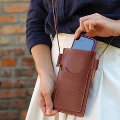 Discover our chic collection of phone bags on Etsy, perfect for the stylish and practical woman! 📱✨ Whether you're looking for a brown slim bag, a leather cell bag, or a personalized gift, we've got something special for you. Our brown phone bags and slim phone bags offer a sleek and elegant solution for carrying your essentials. Choose from our range of leather phone bags and phone purses, ideal for any occasion. From cell phone purses to phone crossbody bags, our small bags and mobile phone b Brown Phone Bag With Cell Phone Pocket For On-the-go, Brown Crossbody Phone Bag For Everyday, Brown Everyday Crossbody Phone Bag, Brown Shoulder Bag With Cell Phone Pocket For Everyday, Brown Shoulder Bag With Cell Phone Pocket, Brown Bag With Hidden Phone Sleeve For On-the-go, Brown Bags With Cell Phone Pocket For Daily Use, Brown Pouch Shoulder Bag With Cell Phone Pocket, Brown Bags With Hidden Phone Sleeve For On-the-go