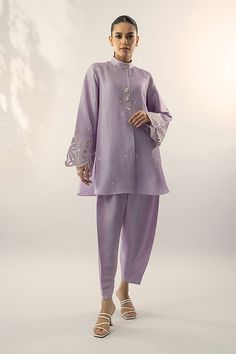 A refreshing lilac shade on a raw silk kurta, is adorned with embroidery on the sleeves and pearl buttons. Pair it with a co-ord trouser. Classy, elegant and summer ready. Indian Co Ord Set Casual, Wedding Palazzo Set With Embroidered Sleeves For Eid, Spring Raw Silk Palazzo Set With Straight Kurta, Raw Silk Palazzo Set With Straight Kurta For Spring, Spring Palazzo Set With Straight Kurta In Raw Silk, Spring Palazzo Set In Raw Silk With Straight Kurta, Designer Wear Spring Kurta With Set-in Sleeves, Designer Spring Kurta With Set-in Sleeves, Elegant Palazzo Set With Embroidered Sleeves And Straight Kurta