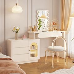 a bedroom with a white vanity, mirror and chair in it's corner next to a window