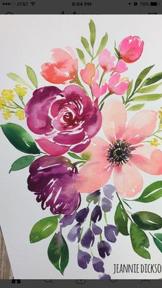 an art project with watercolor flowers painted on paper