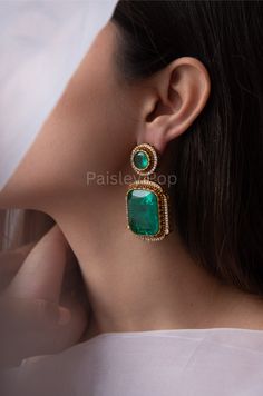 Our Green earrings are inspired by the Victorian era, representing luxury and rich taste. The Victorian earrings feature green doublet stones outlined with cubic zirconia in an array. The cocktail earrings showcase excellent craftsmanship to add a touch of royalty to your Western look. Pair these dazzling earrings with your favorite outfit to make it more lustrous. Closure - Push Back Paisley Pop travels the depths of India to learn techniques and crafts from deep down in the local markets and villages. We give utmost importance to our quality and packaging. Our goal is to ensure you receive exactly what you are looking for and for your experience to be special and memorable. We are ready to help and advise you through your purchase. IT' S  A W E S O M E * Our lovely packaging is designed Sabyasachi Earrings, Green Evening Gowns, Dazzling Earrings, Cocktail Earrings, Western Earrings, Western Look, Free Earrings, Kundan Necklaces, Pearl Collection