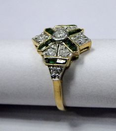 Vintage Art Deco 18 k solid gold Diamond Emerald Ring. Usa ring size-7 ( we can adjust to any size), width-14.5 cm, weight-3.200 grams, Diamond Weight -.50 carat. Material-18 K solid gold natural Emerald and Diamonds. Art Deco Emerald Ring With 17 Jewels For Anniversary, Victorian Gold Emerald Ring For Wedding, Gold Wedding Rings With 17 Jewels, Victorian Emerald Ring For Wedding, Victorian Yellow Gold Emerald Ring For Anniversary, Art Deco Yellow Gold Emerald Ring With Brilliant Cut, Gold Hallmarked Emerald Ring For Wedding, Art Deco Gold Cluster Ring With Rose Cut Diamonds, Antique Emerald Ring With Brilliant Cut For Wedding