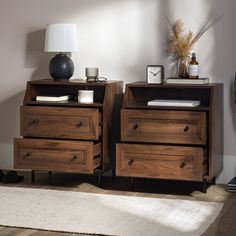 two wooden dressers sitting next to each other on top of a carpeted floor