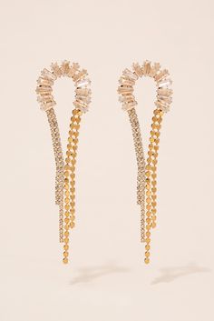 The Vega Half Loop Drop Earrings are the perfect finishing touch to any outfit. The finish adds a touch of glamour, while the rhinestone accents add a touch of sparkle. These earrings are designed with a half loop drop, giving them a unique and eye-catching look. Whether you're dressing up for a special occasion or just looking to add some flair to your everyday look, these earrings are sure to impress. Plus, with their affordable price and trendy design, they make a great gift for any friend or Pearl Shop, Holiday Essentials, Rhinestone Embellishments, Dressing Up, Pearl Set, Gold Rhinestone, Halloween Birthday, Gold Drop Earrings, Pearl Ring