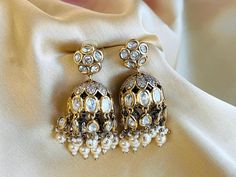 Tayani statement 22k Gold plated Pearl jhumki Earrings. Tayani earrings Elegant Jewelry With Matching Earrings For Navratri, Elegant Festive Earrings For Navratri, Elegant Navratri Festive Earrings, Gold Plated Cutdana Jhumkas As Gift, Elegant Heavy Gold Plated Jhumkas, Elegant Kundan Jhumkas For Eid, Elegant Drop Earrings For Navratri, Elegant Tilla Earrings For Navratri, Bollywood Style Gold Plated Jhumkas For Gift