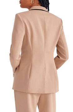 Chic for the office or the weekend, this one-button blazer exudes sophisticated style with smooth stretch fabric and a slighlty oversized fit. 28" length (size Medium) Notched lapels 63% polyester, 32% rayon, 5% elastane Dry clean Imported Chic Structured Blazer With Pressed Crease, Structured Career Suit With Hidden Button Closure, Chic Structured Notch Lapel Blazer, Elegant Flat Front Outerwear For Workwear, Elegant Workwear Outerwear With Flat Front, Sleek Tailored Blazer In Solid Color, Chic Blazer With Structured Shoulders For Business Casual, Chic Business Casual Blazer With Structured Shoulders, Sleek Tailored Solid Color Blazer