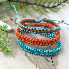 "Matching bracelet for family, made of waxed cord. These waterproof adjustable bracelets are the perfect combination to wear on Season Football Game. These Football Team bracelets were designed for everyday wear. These minimalist boho Turquoise and Orange cord bracelets enhance your casual outfit. ♥ ITEM DETAILS: Total length: The size of the bracelet is adjustable. 💕The bracelet has an adjustable closure that will work on a wrist of about 6 - 7\"💕 Materials: Waxed cord. Waxed Cord Available: Casual Handmade Orange Friendship Bracelets, Handmade Orange Casual Friendship Bracelet, Casual Handmade Orange Friendship Bracelet, Adjustable Orange Braided Bracelet With Sliding Knot, Casual Orange Braided Bracelets For Friendship, Casual Orange Braided Bracelet For Friendship, Adjustable Orange Friendship Bracelets With Sliding Knot, Adjustable Orange Friendship Bracelet With Sliding Knot, Adjustable Orange Friendship Bracelets