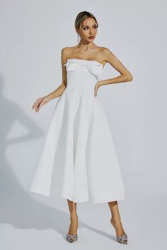 Elevate your elegance with the Andi White Bow Off Shoulder Dress. This elegant, ladylike dress exudes sophistication with its tube top design, perfect for a simple dinner or a formal occasion. The slim waist enhances your figure, while the long dress adds a touch of grace.   Dress Length: Approx 103cm Materials: 100% Polyester Gentle Dry Clean Only  The model is 5 ft 74 and wears size S  Color may vary due to lighting on images. The product images (without a model) are closest to the true color Ladylike Dress, White Bow, Slim Waist, Formal Occasion, Tube Top, Off Shoulder Dress, Dress Length, Shoulder Dress, Long Dress