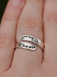 "Copy and paste into your browser, get 15% off ➔ https://bit.ly/VD15OFF Like wildflowers, you must allow yourself to grow in all the places people never thought you would. DETAILS: -Each ring is hand stamped -Ring is Aluminum or Sterling Silver -4mm in thickness You will receive one hand-stamped lavender aluminum ring filled with a black enamel finish. **Every item is handmade, this means that each will be unique and may not look EXACTLY like the picture, but it will look very similar ➡ORDER PRO Adjustable Hypoallergenic Flower Ring As Gift, Spring Gift Open Ring, Minimalist Rings As Spring Season Gifts, Minimalist Rings For Spring Gift, Minimalist Ring As Spring Season Gift, Minimalist Ring As Spring Gift, Minimalist Spring Rings For Gift, Adjustable Flower Ring For Spring Anniversary, Spring Anniversary Adjustable Flower Ring