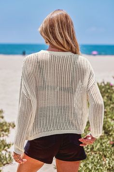 Forget boring beach sweaters. The Open Knit Drop Shoulder Long Sleeve Cover-Up is here to shake things up. With its relaxed drop shoulder design and airy open knit, this cover-up combines cozy vibes with a touch of seaside chic. Product code: CAA07A4G013GG Features:  Knit Round neckline Drop shoulder Long sleeve Wash Method: Regular Wash Material: 100%POLYESTER. Soft Knit Sweater For Vacation, Casual Knitted Beach Sweater, Spring Crew Neck Sweater For Vacation, Crew Neck Sweater For Spring Vacation, Trendy Crew Neck Sweater For Beach, Crew Neck Sweater For Vacation In Spring, Casual Beach Sweater For Beach Season, Casual Beach Sweater, Soft Knit Sweater For Summer Beach