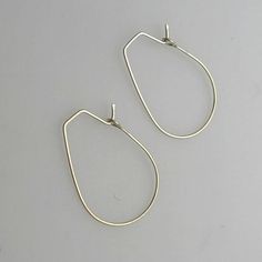 Lightweight, shiny teardrop hoop earrings. Sterling silver earrings to shine on! The teardrop shape is classics that never goes out of fashion. It always stays relevant.Be sure, the earrings are comfy and so you can wear them long without feeling any discomfort.They are crafted of hypoallergenic sterling silver that will always keep the fascinating look.These are earrings that certainly must be in your collection!Features:- Teardrop shaped earrings- Modern Style- Sterling silver- LightweightDeta Modern Small Hoop Teardrop Earrings For Pierced Ears, Modern Nickel-free Drop Hoop Earrings, Minimalist Metal Teardrop Hoop Earrings, Minimalist Teardrop Metal Hoop Earrings, Metal Teardrop Earrings With Lever Back, Minimalist Metal Teardrop Earrings For Pierced Ears, Everyday Metal Drop Hoop Earrings, Modern Teardrop Pendant Earrings With Ear Wire, Minimalist Metal Teardrop Drop Earrings