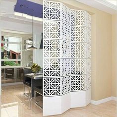 the room divider is designed to look like an intricate lattice design, and has been cut