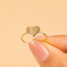 A sign for your heart, our solid 14k gold ring is ready to show what your heart can't. Adding a personal touch to this ring with an engraving is essential. We can Engrave almost anything - Initials, Zodiac signs, Hearts, Stars, you name it! - Handmade - Solid Gold - Dimensions of the Heart: 8.65 x 9.7 mm - Size of the Band: 1.2 mm 🛠 Your Sarah Elise piece is handcrafted with care! Ready-to-ship items go out within 3 business days. Made-to-order pieces typically take 7-10 business days to create 14k Gold Hallmarked Heart Ring For Promise, Personalized 14k Gold Heart Ring For Promise, Personalized 14k Gold Heart Promise Ring, Personalized 14k Gold Heart Ring Fine Jewelry, Personalized 14k Gold Heart Cut Rings, 14k Gold Polished Finish Promise Heart Ring, Engraved Heart Promise Ring In Fine Jewelry Style, 14k Gold Heart Ring With Polished Finish For Anniversary, Heart-shaped Engraved Promise Ring