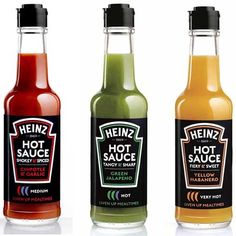 three bottles of hot sauce on a white background