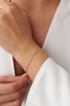 Our new simple and dainty Figaro chain bracelets, as always made in 14k solid gold. You can wear this bracelet with a free mind without worrying about water, perfume, or conditioner contact since real gold never tarnishes.★ Features of the Bracelet (this listing is for a single bracelet only)• Gold Kt: 14K Solid Gold (all pieces are stamped for authenticity)• Available Gold Color: Yellow Gold• Chain Width: 2.5 mm Minimalist 14k Gold Charm Bracelet With Delicate Chain, Dainty 14k Gold Jubilee Chain Bracelet, Dainty Gold Sterling Silver Bracelet For Everyday, Everyday 14k Gold Bracelet With Figaro Chain, Everyday 14k Gold Figaro Chain Bracelet, Delicate 14k Gold Bracelet With Delicate Chain, 14k Yellow Gold Bracelet With Simple Design, Dainty 14k Gold Link Bracelet, Simple 14k Yellow Gold Bracelet