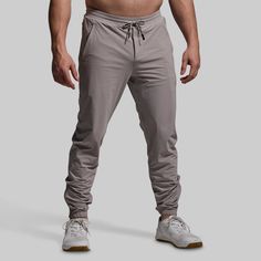 It doesn’t get more lightweight than this. Made from an ultra-breathable fabric, our Performance Jogger boasts distraction-free comfort that’s made for warm days in the gym, on the track, or around town. Added stretch provides maximum range of motion while a side-zipped leg opening allows for even greater mobility. With the ideal balance of comfort, function, and utility, these joggers will quickly become your go-to for summer training days. Urban Activewear For Gym With Go-dry Technology, Cotton Joggers For Workout During Sports Season, Athleisure Joggers With Moisture-wicking, Urban Style Athletic Fit Activewear For Sports, Gray Activewear For Training During Sports Season, Urban Athletic Fit Activewear For Sports, Functional Moisture-wicking Midweight Joggers, Functional Midweight Moisture-wicking Joggers, Urban Moisture-wicking Activewear For Gym