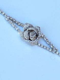 "Hello, welcome to Ken's Closet Today we have a beautiful Rose style CZ Diamond Bracelet. This is very sparkly. This bracelet is in a silver setting. Diamonds are AAA Certified and sparkle beautifully. We offer this style in 2 different sizes. - 6\" - 7\"" Rose Style, Crystal Rose, Flower Bracelet, Cz Diamond, Beautiful Rose, May 11, Chandelier Earrings, Beautiful Roses, Rose Flower