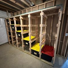 the storage room is filled with lots of boxes and bins for various things to be stored