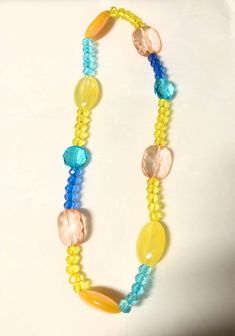 Tropical beaded necklace . Acrylic beads. 8 inch length Yellow Necklaces With Colorful Beads For Summer, Yellow Single Strand Bohemian Necklace, Yellow Round Bead Necklaces For Summer, Yellow Bohemian Single Strand Necklace, Yellow Round Beads Necklace For Summer, Summer Yellow Beaded Necklaces With Large Beads, Summer Yellow Beaded Necklaces, Yellow Beaded Necklaces With Large Beads For Summer, Yellow Beaded Necklaces With Round Beads For Summer