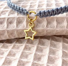 Handmade macrame star bracelet in grey - boho jewelry for your soul Be enchanted by MissBoysenberry's lovingly handmade macrame bracelet, decorated with a charming star in the middle. This unique bracelet in a clear grey tone is the perfect accessory to accentuate your boho style. Whether you wear it alone or combine it with other bracelets, this piece of jewelry will surely find a special place in your heart. Each bracelet is crafted with the utmost care and attention to detail to provide you w Bracelet With Pendant, Macrame Star, Grey Bracelet, Grey Boho, Bracelet Star, Gray Bracelet, Bracelet Friendship, Macrame Bracelet, Handmade Macrame