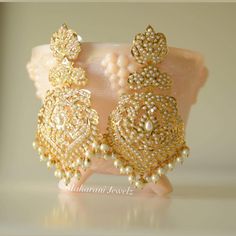 Ready to be shipped (Navratan option only) Pearl option will take a minimum of 3 weeks Beautiful 21k gold plated jadao earrings make a lovely statement for any bridal outfit or special occasion. Style: push-in Length: 3.5 inches Elegant Kundan Bridal Earrings With Stone Work, Temple Jewelry Style Chandelier Earrings For Reception, Gold Earrings For Wedding And Diwali, Elegant Kundan Pearl Earrings With Stone Work, Gold Heavy Bridal Earrings For Celebration, Gold Chandbalis With Tilla For Reception, Gold Kundan Bridal Earrings For Wedding, Kundan Bridal Earrings With Pearl Drop For Wedding, Gold Plated Bridal Earrings For Festivals