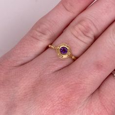 This stunning amethyst set in yellow gold is is sure to take your breath away! This ring provides a look that is very modern yet classic. This ring is very fashionable and can add a touch of style to any outfit, yet it is also classy enough to pair easily with formal wear. It looks beautiful by itself but also looks wonderful in a stack or as a wedding band! This ring would make the perfect gift for yourself or your loved one!14K Yellow GoldGemstone: AmethystGemstone Weight: .22 CaratsGemstone S Yellow Gold Amethyst Ring With Accent Stones, Round Cut, Yellow Gold Amethyst Ring With Round Cut Accent Stones, Yellow Gold Amethyst Ring With Center Stone, Yellow Gold Amethyst Ring With Round Cut, Yellow Gold Birthstone Ring With Amethyst Center Stone, Amethyst Center Stone Birthstone Ring In Yellow Gold, Formal Gold Amethyst Ring With Bezel Setting, Fine Jewelry Gold Amethyst Ring, Elegant Gold Solitaire Amethyst Ring