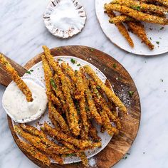 fried french fries on a plate with ranch dressing