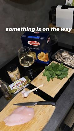 a cutting board that has some food on it and a knife next to it with the words something is on the way