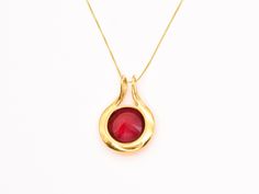 Gold Ruby Pendant set with a Created Ruby in a flawless diamond cut & bright red color, at 18mm (20 Carats).Gold Vermeil: 18k Gold over Solid 925 Sterling Silver ☞ made to last.Click here for ☞ Statement Jewelry CollectionMatching Ring & Earrings ☞ please ask meDetails:• Created Ruby in a flawless clarity• Ruby: 18mm, 20 Cts, diamond• Dimensions: Pendant Height 32mm, Width 22mm• Free Complimentary Chain• 18k Gold VermeilSKU 1246 Ruby Pendant Set, Flawless Diamond, Ruby Pendant, Gold Statement Necklace, Red Necklace, Pendant Set, Diamond Cut, Bright Red, Statement Jewelry