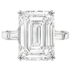 This elegant ring showcases a GIA certified 5.05 carat emerald cut diamond, accented by tapered baguette side stones. The Ring have a diamond of the D color grade are considered truly colorless, offering a brilliant sparkle that maximizes the reflection of light. These diamonds are the highest quality and are perfect for creating timeless, stunning jewelry pieces. With minute inclusions that are hard to spot, this VVS2 diamond provides excellent purity and brilliance, making it a great choice fo Harry Winston Diamond, Emerald Cut Diamond Engagement, Contemporary Engagement Rings, Emerald Cut Diamond Ring, Dream Party, Baguette Diamond Rings, Platinum Diamond Rings, Modern Engagement Rings, Bracelet Love