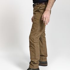 STORY Our flagship pant, the Foundation has been with us since the very beginning. This timeless classic was designed and built to be as ready an option as your favorite pair of jeans; they will no doubt contend for the top position as your go-to pant for daily wear in all conditions. Attention to details and fit, the Foundation is built with function, durability and versatility all in mind. This pant is constructed in our State-side Canvas, a substantial fabric is micro sanded and has a fusion treated finish that will allow the garment to slowly fade to add character and make each garment one of a kind. Imagine the fades of your favorite worn in Jean but in canvas earth tones.Whether you like to keep the pant clean or like the fading, we created the garment, make it your own. PROCESS Sewn Classic Brown Straight Bottoms, Brown Straight Leg Chinos With Welt Pockets, Chino Cotton Twill Straight Pants With Belt Loops, Classic Straight Fit Bottoms With Belt Loops, Classic Jeans With Standard Cut Leg For Workwear, Chino Cotton Twill Work Pants With Straight Hem, Brown Straight Bottoms With Five Pockets, Classic Workwear Jeans With Belt Loops, Brown Straight Pants With Five Pockets