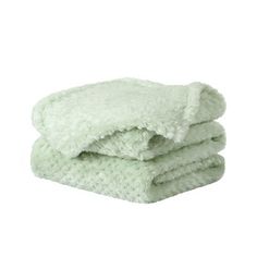 two green towels stacked on top of each other