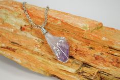 Each Amethyst necklace is carefully hand wrapped with silver plated copper wire and is suspended from a stainless chain. Pendant measures approximately 1 1/2 inches in length. Each stone is cleansed, charged and blessed before shipping to maximize it fullest potential. NOTE: Item pictured is NOT the exact Item you will receive. All items in stock bear a close resemblance to the item pictured, but because these are natural stones, the size, shape and color will slightly vary for the item purchase Lavender Wire Wrapped Necklace For Gift, Amethyst Wire Wrapped Necklace Gift, Spiritual Silver Plated Wire Wrapped Necklace, Spiritual Lavender Wire Wrapped Necklaces, Silver Amethyst Wire Wrapped Necklace, Purple Wire-wrapped Silver Jewelry, Chakra Healing Stones, Heart Chakra Healing, Malachite Necklace