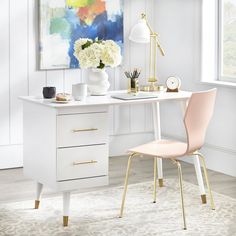 a white desk with gold legs and a pink chair next to it, in front of a window