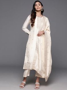 * Floral Woven Design Zari Regular Kurta with Trousers & Dupatta Silk Kurta Set / Pakistani Salwar Kameez / Indian Wedding Dress / Plus Size Cotton Dress / Traditional Indian Wear / Salwar Kameez Dupatta / Kurti Palazzo Set    * Cream-coloured woven design Kurta with Trousers with dupatta *Kurta design:- * Floral woven design * Straight shape * Regular style * Round neck, three-quarter regular sleeves * 2 pockets zari detail * Calf length with straight hem * Silk blend fabric * Trousers design:- Elegant Jamawar Salwar Kameez For Wedding, Unstitched Jamawar Kurta For Wedding, Formal Anarkali Unstitched Suit With Pallu, White Banarasi Silk Kurta For Eid, Semi-stitched Jamawar Traditional Wear For Wedding, Unstitched Wedding Kurta In Jamawar, Elegant Churidar With Pallu For Designer Wear, Elegant Designer Churidar With Pallu, Anarkali Jamawar Kurta For Wedding