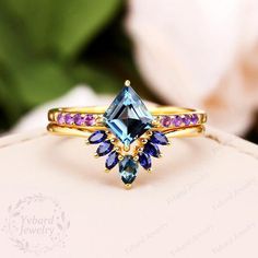 a ring with blue and purple stones on it