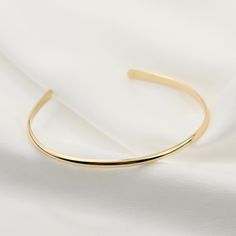 "14K gold cuff bracelet. 14K Gold Minimalist Cuff Bracelet, Delicate cuff bracelet. The bracelet will be shipped in a gift box * 14K solid gold. It is about 2.5mm width. Please select the size of your wrist. If your wrist is 6\", please purchase a 6\" bracelet. (If you order a 6\" bracelet, actual cuff length will be 5\" plus 1 inch opening.) Please read our policies before you place your order. https://www.etsy.com/shop/SashJewelry/policy?ref=shopinfo_policies_leftnav To see other Mother daught Elegant Gold Bracelet With Open Band, Adjustable Gold Cuff Bracelet For Everyday Luxury, Elegant Gold Open Band Bangle, Gold Open Band Bangle Gift, Gold Open Cuff Elegant Jewelry, Elegant Everyday Luxury Cuff Bangle Bracelet, Elegant Gold Open Cuff Jewelry, Elegant Cuff Bangle As A Gift, Luxury Open Band Cuff Bracelet As Gift