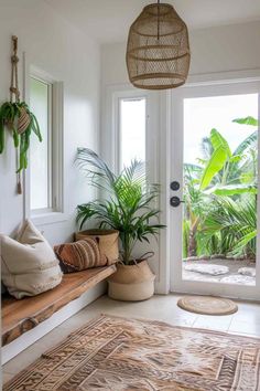 a living room with plants and rugs on the floor