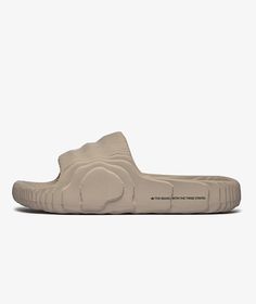 The ADILETTE 22  product from the brand   adidas from the  SP2023  campaign , has arrived || is now available at . Adidas Adilette 22, Beige Adidas, Slide Shoes, Adidas Adilette, Shoes Adidas, Slides Shoes, Saudi Arabia, Adidas Shoes, Adidas