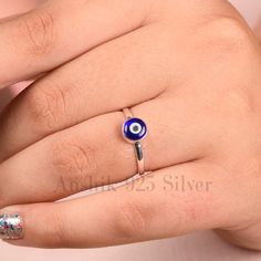 "Tiny Evil Eye Ring, Dainty Stacking Ring, Minimalist Jewelry, Good Luck Charm, Protection Ring, Band Sterling Silver Ring, Bohemian Fashion. Product Detail: Material :925 sterling Silver Size: 6.00MM Shape: Round Setting : Bezel Style :- Boho & hippie Occasion : Anniversary, Baby shower Color: Blue & White The evil eye is a \"look\" or \"stare\" that is believed to bring bad luck for the person at whom it is directed for reasons of envy or dislike. The perception of the nature of the phenomenon Om Silver Ring, Adjustable Tiny Silver Midi Rings, Adjustable Dainty Toe Rings As Gift, Adjustable Dainty Toe Rings For Gift, Handmade Adjustable Minimalist Toe Rings, Minimalist Nickel-free Toe Rings As Gift, Dainty Handmade Adjustable Midi Rings, Adjustable Spiritual Stackable Rings As Gift, Adjustable Sterling Silver Midi Rings As Gift