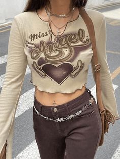 ⚡️Buy Miss Angel Heart Knit Crop Top Beige S under $18.00 in Knits Online. Style: Casual/Street/Sweet/Y2K/Vintage/Preppy. Fabric Content: Cotton, Spandex. Fit Type: Slim fit. Neckline: Crew Neck. Sleeve Length: Long Sleeve. : Crafted from stretchy cotton knit fabric, these such cute tops shaped to a tighten silhouette, features a u-cut crew neck style, miss angel letter heart pattern print at front and split cuffs detailing, ended with stitching seam design.. ✓Free Shipping on all orders over US Preppy Fabric, Leather Tank Top, Backless Cami Top, Angel Heart, Vintage Preppy, Crochet Halter Tops, Short Sleeve Cropped Top, Casual Tops For Women, Print Crop Tops