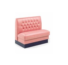 a pink couch sitting on top of a white floor