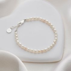 I promise to be there with every beat of my heart and she will hold you close to hers, with this beautiful Promise Bracelet. A classic girl's freshwater pearl bracelet, this will be a long lasting reminder of your love for her, as it is adjustable and so can be worn throughout her life. A matching Promise Necklace is also available. For all moments that matter, quality keepsake children's jewelry that arrives with luxury gift wrap. Adjustable Sterling Silver Pearl Charm Bracelet, Adjustable Hypoallergenic Pearl Bracelet For Anniversary, Adjustable Sterling Silver Pearl Drop Bracelet, Classic Adjustable Hypoallergenic Pearl Bracelet, Classic Adjustable Pearl Bracelet For Anniversary, Adjustable Classic Pearl Bracelet For Anniversary, Adjustable Sterling Silver Beaded Bracelets With Pearl Charm, Adjustable Hypoallergenic Pearl White Pearl Bracelet, Adjustable Jubilee Pearl Bracelet For Anniversary